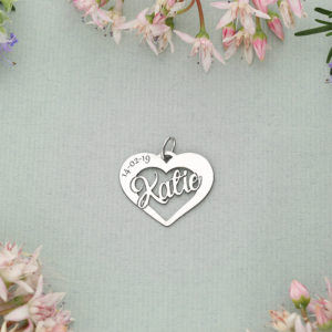 A love heart charm with an engraving of your choice across