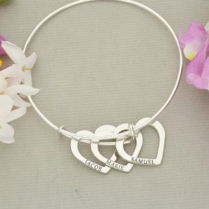 Silver expandable bangle with silver hearts. Starting from