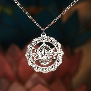 A detailed and intricate silver mandala with lotus centre.