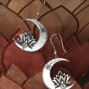 A pair of silver lotus and moon earrings.