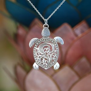 A silver turtle mandala charm. 4cm in length