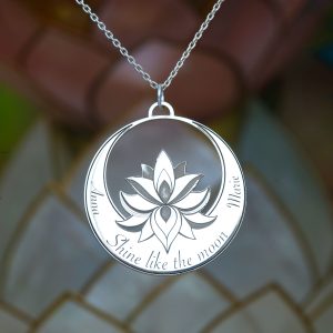 A personalised silver charm with the lotus flower and  crescent moon.