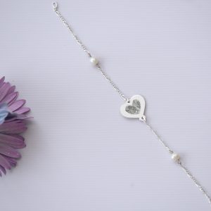 A Silver Bracelet with Pearls and a Personalised Heart engraved with fingerprints